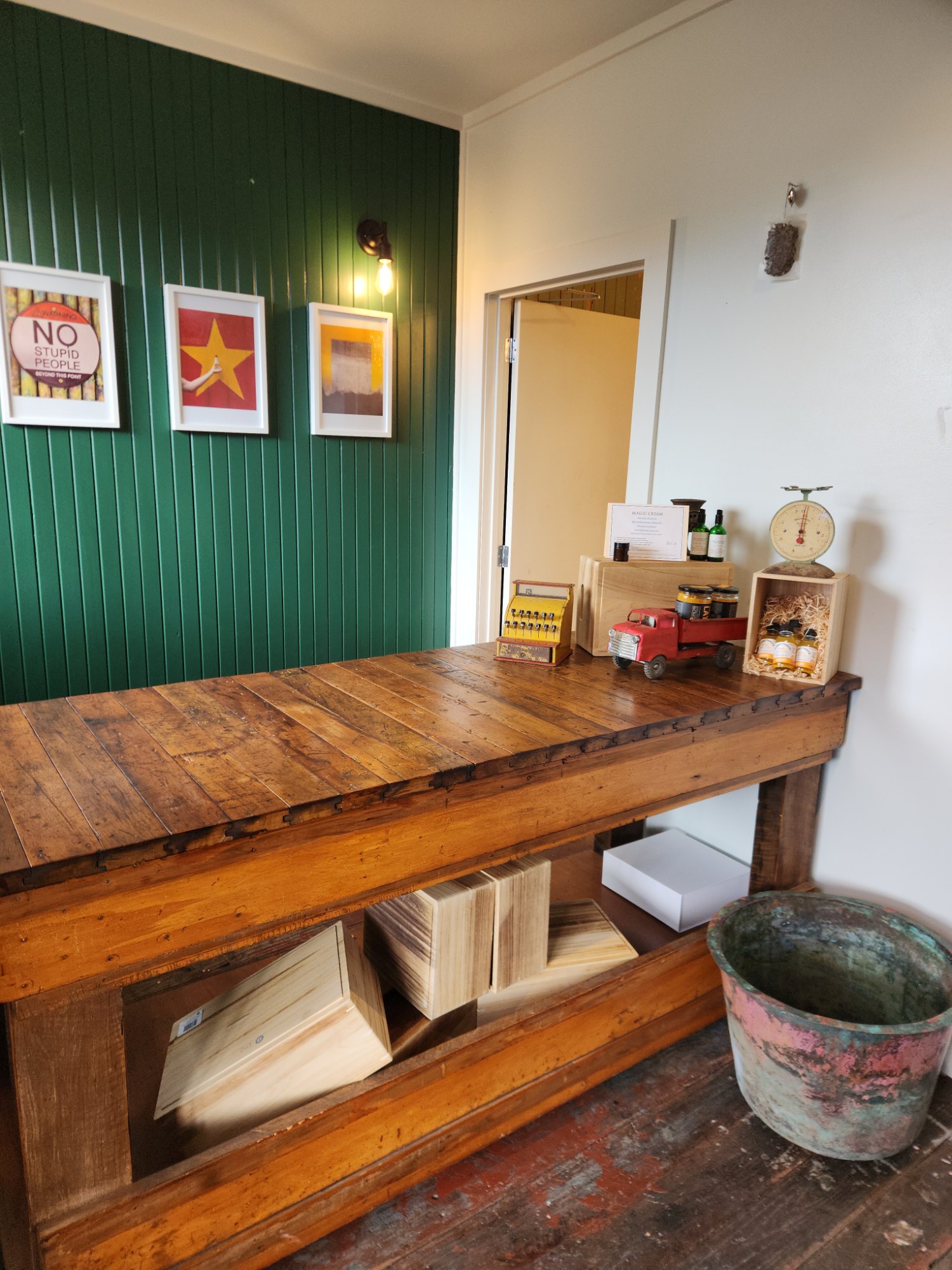 A Turbo Tonic bottle on a farmhouse kitchen table beside a steaming mug, honey and fresh limes